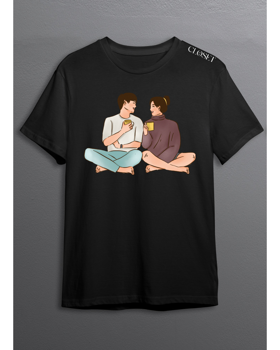 Black t-shirt featuring a couple sitting cross-legged with coffee mugs, sharing an intimate moment – HH Closet Retro Collection